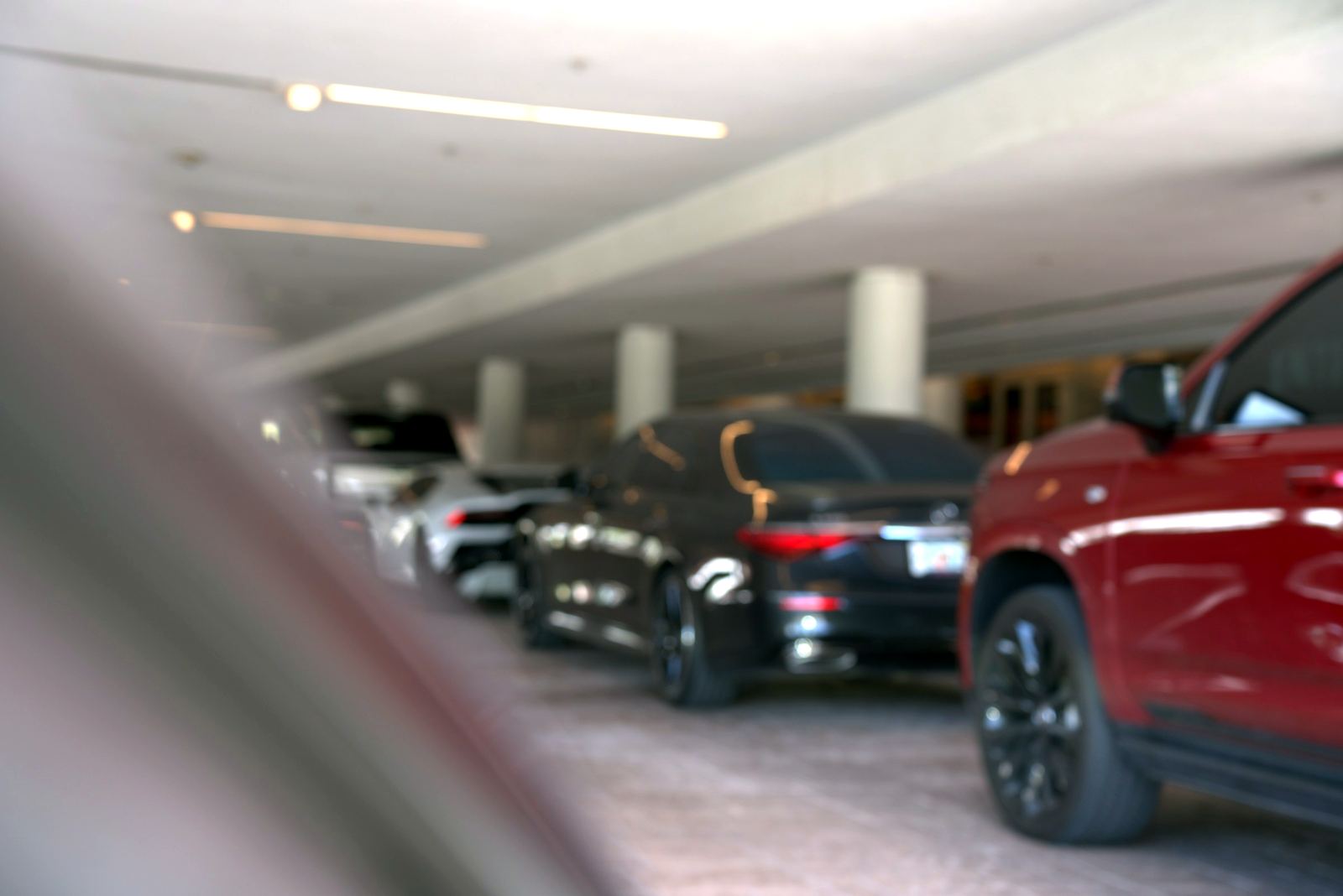 Cars waiting under a covered valet entrance