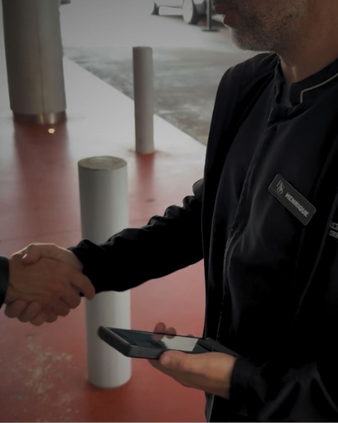 HVS attendant greeting a guest with a handshake