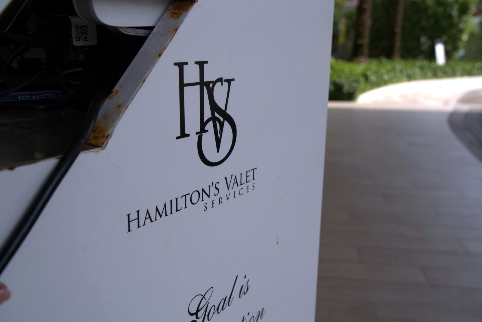 Hamilton's Valet Services sign at a valet stand